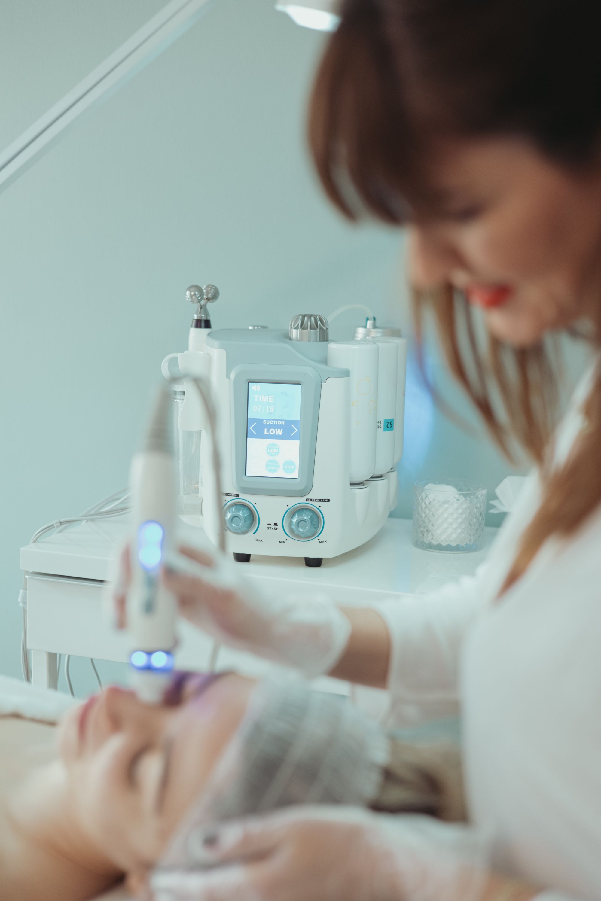 A hydrating facial treatment with a handheld wand