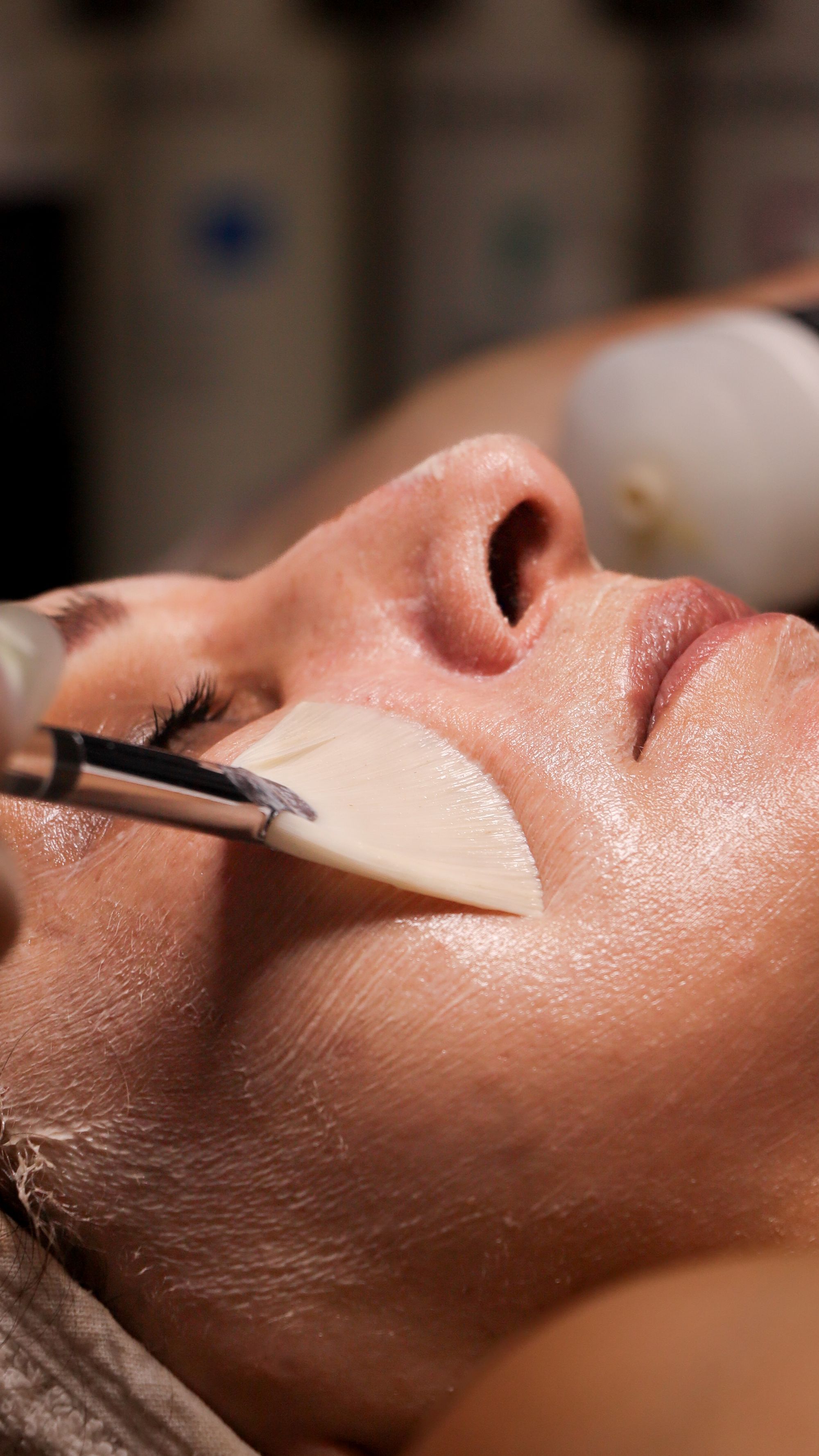 Close-up of a peel being brushed onto the skin